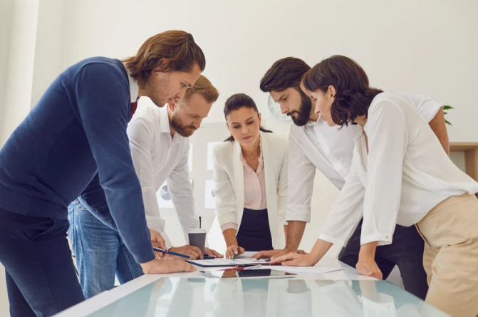  Group of coworkers around a table 