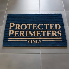 doormat that says protected perimeters only